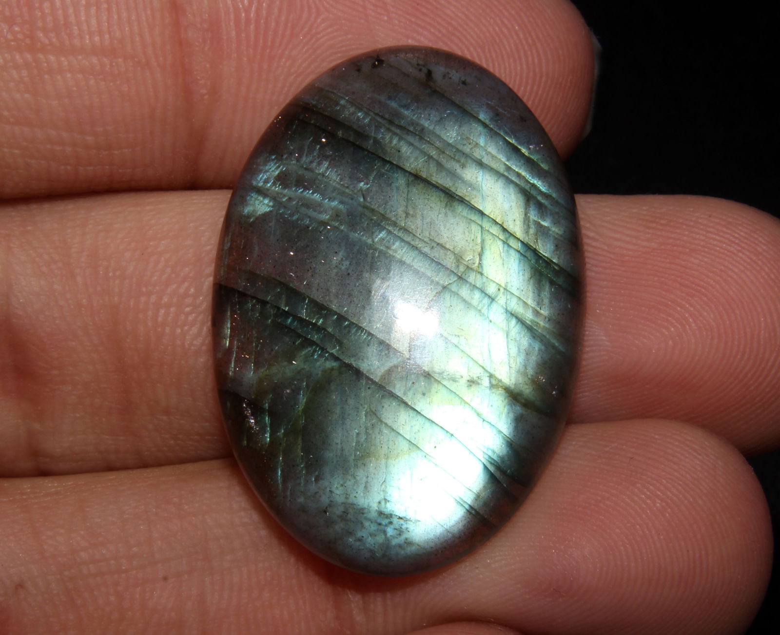 Delightful " Natural Labradorite " 38.56 Cts Natural Labradorite: Gemstone : Natural Labradorite Shape : Oval Shape Cabochan Weight : 38.56 caratsMeasurements : 31x22 mm, Color : Black Transparency : Opaque Treatment : None Origin : India Shipping-: Flat rate of $7.