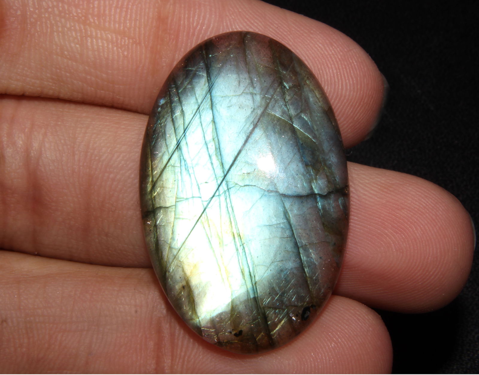 Marvellous " Natural Labradorite " 43.30 Cts Natural Labradorite: Gemstone : Natural Labradorite Shape : Oval Shape Cabochan Weight : 43.30 caratsMeasurements : 35x24 mm, Color : Black Transparency : Opaque Treatment : None Origin : India Shipping-: Flat rate of $7.