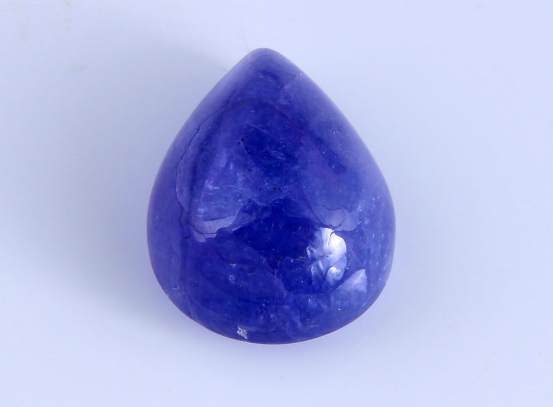 Stunning " Natural Tanzanite " 7.70 Cts Natural Tanzanite: Gemstone : Natural Tanzanite Origin: Tanzania Weight : 7.70 carats Dimensions : 13x10 mm Shape /Cut: Pear Cabochan Color : Violet Transparency : transparent Treatment : none Shipping-: Flat rate of $7