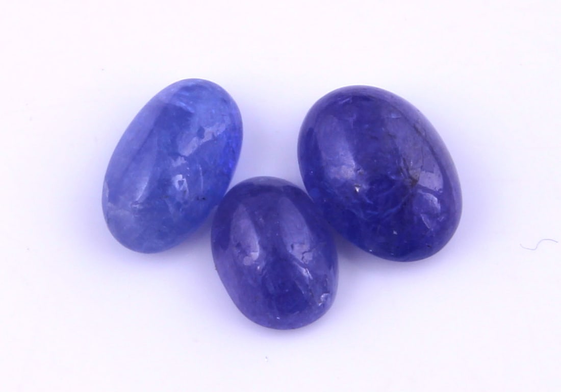 Delightful " Natural Tanzanite " 6.25 Cts Natural Tanzanite Lot: Gemstone : Natural Tanzanite Origin: Tanzania Weight : 6.25 carats Dimensions : 9.92x7.33x4.16 mm 8x6 mm Shape /Cut: Oval Cabochon Color : Violet Number of Stone : 3 Transparency : transparent Treatme