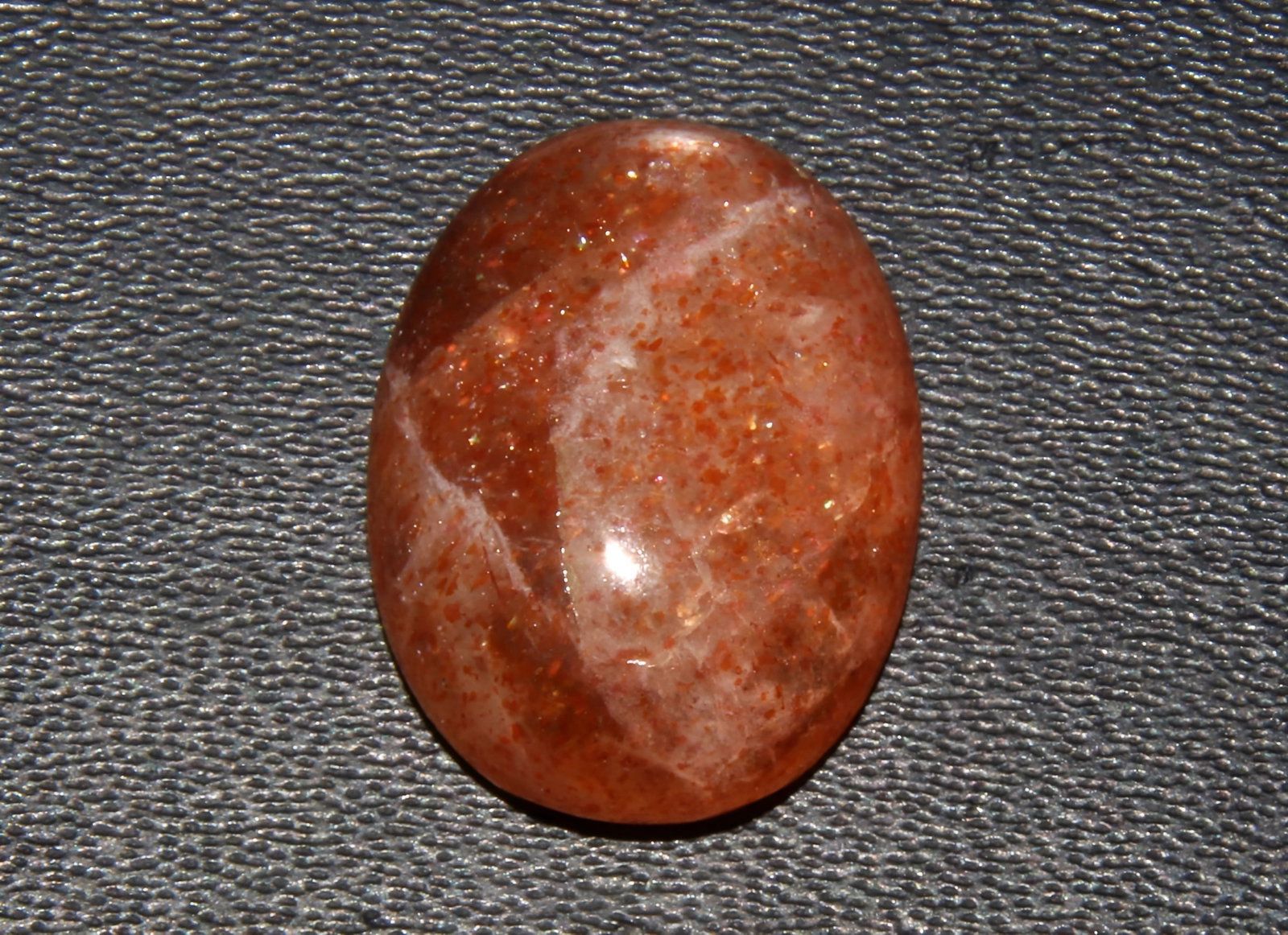 Beautiful 7.90 Cts Natural Orange Sunstone: Gemstone : Natural Sunstone Shape and cut : Oval Cabochon Origin : Africa Weight : 7.90 carats Measurements : 15.69x11.84x5.47 mm , Color : Orange Transprancy : Opaque Treatment : None Clarity : VVSbr
