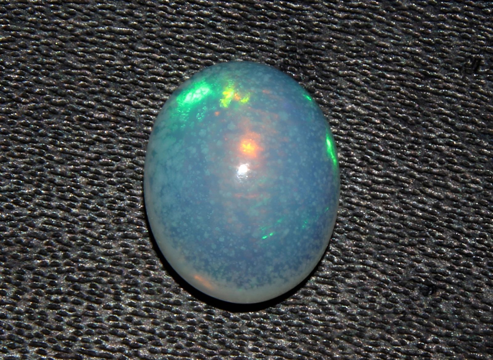 Gorgeous 1.64 Cts Natural Ethiopian Opal: Gemstone : Natural Ethiopian Opal Shape and cut : Oval Cabochon Weight : 1.64 Carats Measurements : 10x8 mm, Color : White Transparency : Translucent Treatment : None Origin : Ethiopian Clarity : VVS 