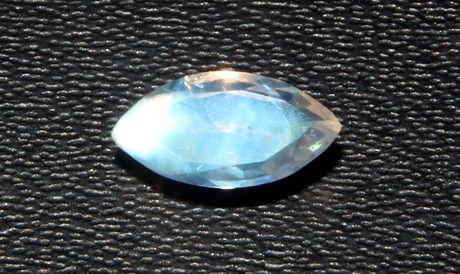 Lovely 0.76 Cts Natural Rainbow Moonstone: Gemstone : Natural Rainbow Moonstone Shape : Marquies Cut Weight : 0.76 carats Measurements : 8x4 mm Color : White Transparency : Opaque Treatment : None Origin : India Clarity : VVS Shipping-: Flat r