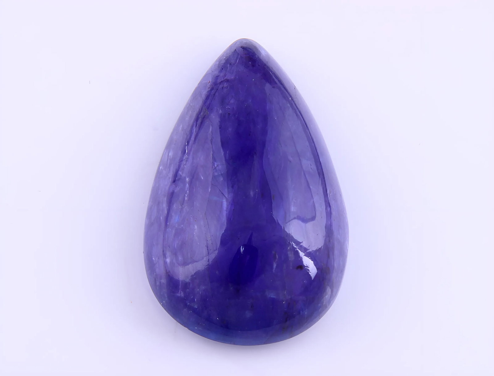 Gorgeous 10.00 Cts Natural Tanzanite: Gemstone : Natural Tanzanite Origin: Tanzania Weight : 10.00 carats Dimensions : 18.63x11.51x5.56 mm Shape /Cut: Pear Cabochan Color : Violet Transparency : transparent Treatment : none Shipping-: Fla