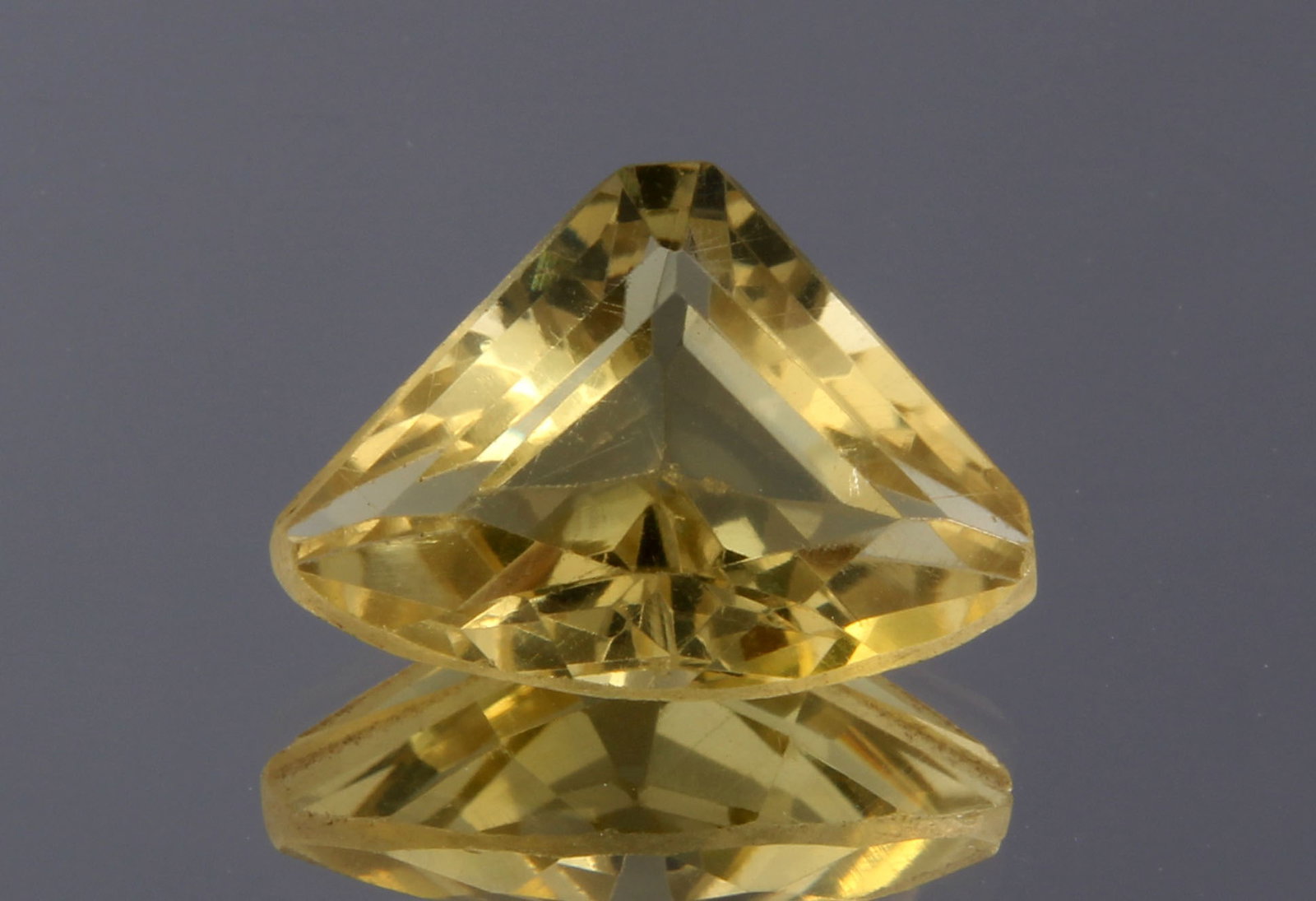 Wonderful 3.14 cts Natural Lemon Quartz: Gemstone: Natural Lemon Quartz Origin: Africa Weight : 3.14 carats Measurements: 9.34x12.92x5.87 mm, Shape / Cut : Trillion Cut Colour: Yellow Transparency: transparent Treatment : No Treatmentnt: non