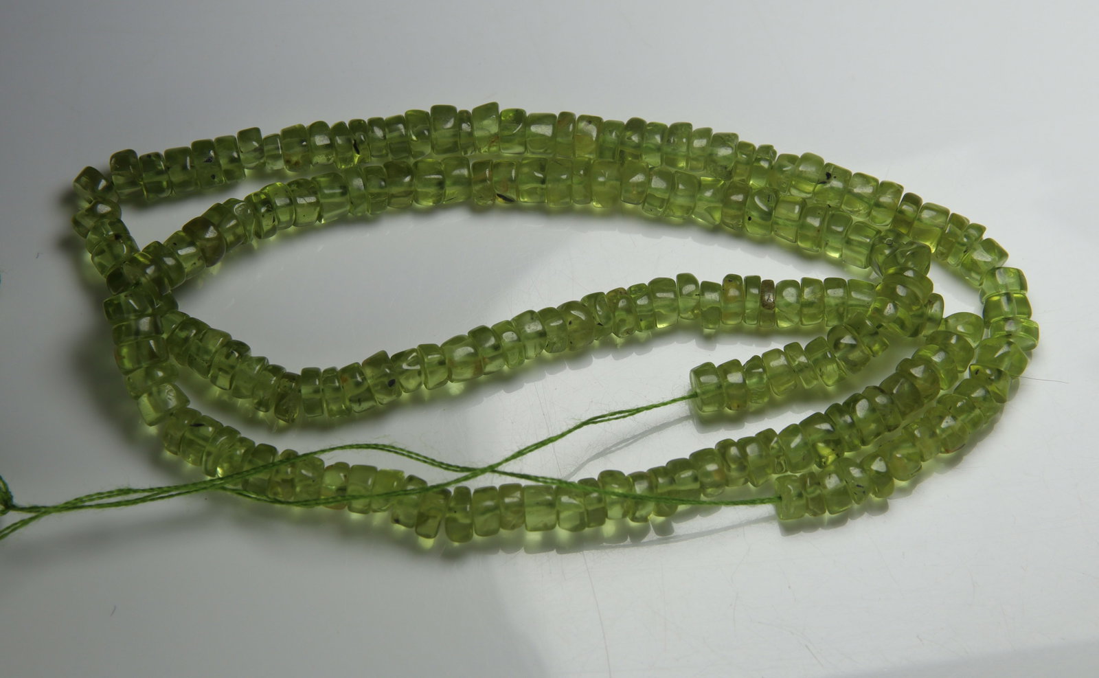 Lovely 79.42 cts Natural Peridot: Gemstone : Natural Peridot Weight : 79.42 carat Shape : Beads Cabochan Dimensions : 4x4 mm Color : Green Origin : India Treatment : No Treatment Transparency : Transparent" Flat rate of $7.00 to anywh