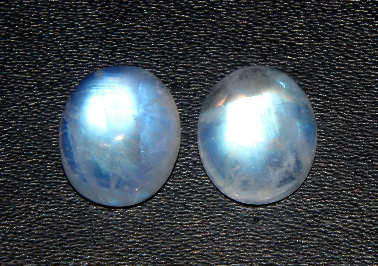 Gorgeous 7.60 Cts Natural Rainbow Moonstone Set: Gemstone : Natural Rainbow Moonstone Shape : Oval Cabochan Weight : 7.60 carats Measurements : 11x9 mm Color : White Number of Stone : 2 Transparency : Opaque Treatment : None Origin : India Clarity :