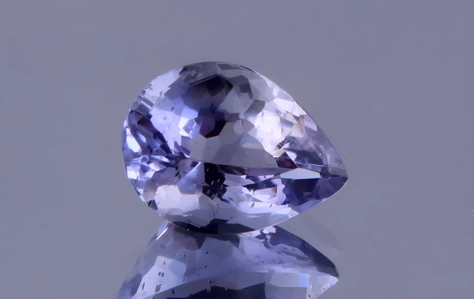 Delightful 0.68 Cts Natural Iolite: Gemstone : Natural Iolite Shape / cut : Pear Cut Weight : 0.68 carats Dimensions : 7x5 mm , Color : Violetish Blueish Blue Transparency : Transparent Treatment : No Treatment Origin : India Clarity :