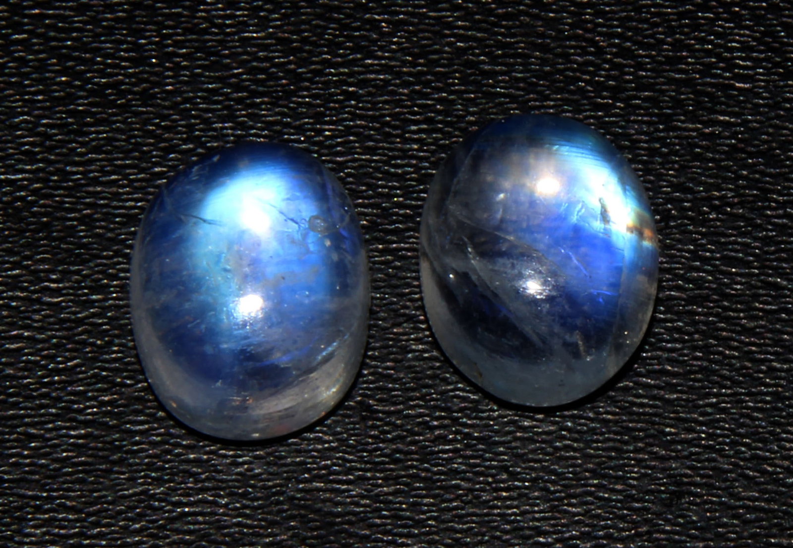 Gorgeous 5.92 Cts Natural Rainbow Moonstone Pair: Gemstone : Natural Rainbow Moonstone Shape : Oval Cabochan Weight : 5.92 carats Measurements : 10x8 mm Color : White Number of Stone : 2 Transparency : Opaque Treatment : None Origin : India Clarity :