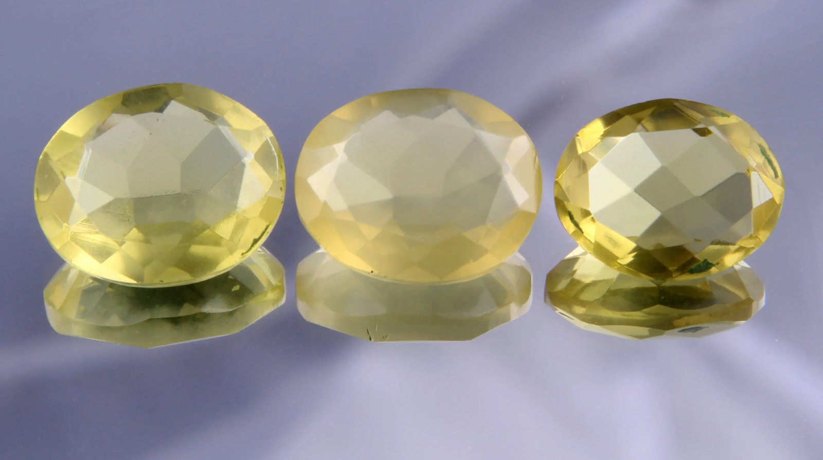 Stunning " Natural Lemon Quartz " 12.48 cts Natural Lemon Quartz Layout: Gemstone: Natural Lemon Quartz Origin: Africa Weight : 12.48 carats Measurements: 12.50x10.12x5.48 mm, 11.43x9.12x5.10 mm Shape / Cut : Oval Cut Colour: Yellow Number of Stone : 3 Transparency: transp