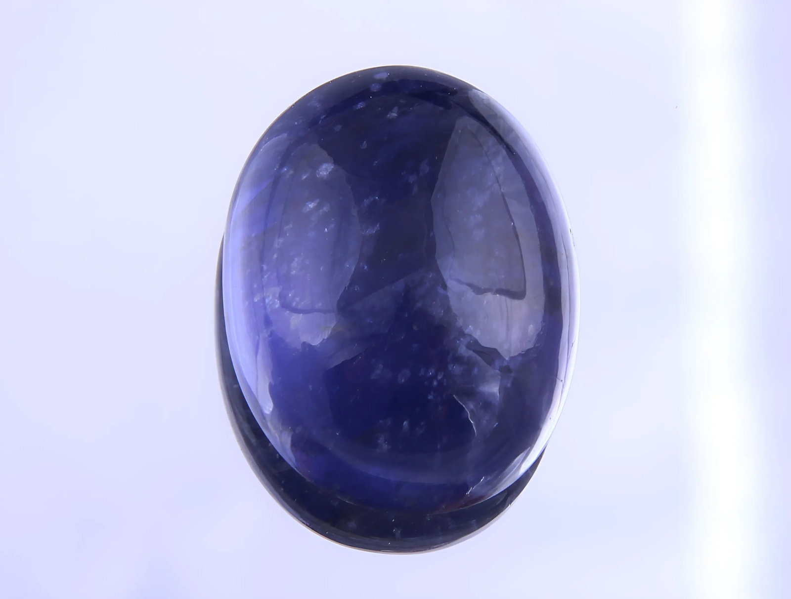 Awesome 8.19 Cts Natural Iolite: Gemstone : Natural Iolite Shape / Cut : Oval Cabochan Weight : 8.19 Carats Dimensions : 15.18x11.65x6.35 mm, Color : Violite Transparency : Transparent Treatment : No Treatment Origin : Nepal Clarity