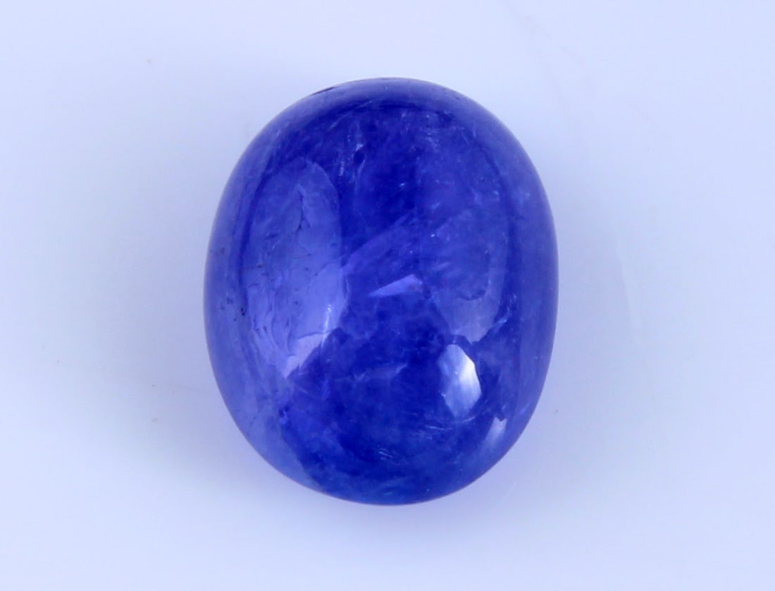 Stunning " Natural Tanzanite " 2.97 Cts Natural Tanzanite: Gemstone : Natural Tanzanite Origin: Tanzania Weight : 2.97 carats Dimensions : 11.68x7.43x4.59 mm Shape/Cut: Oval Cabochan Color : Violet Transparency: transparent Treatment: none Shipping-: Flat rat