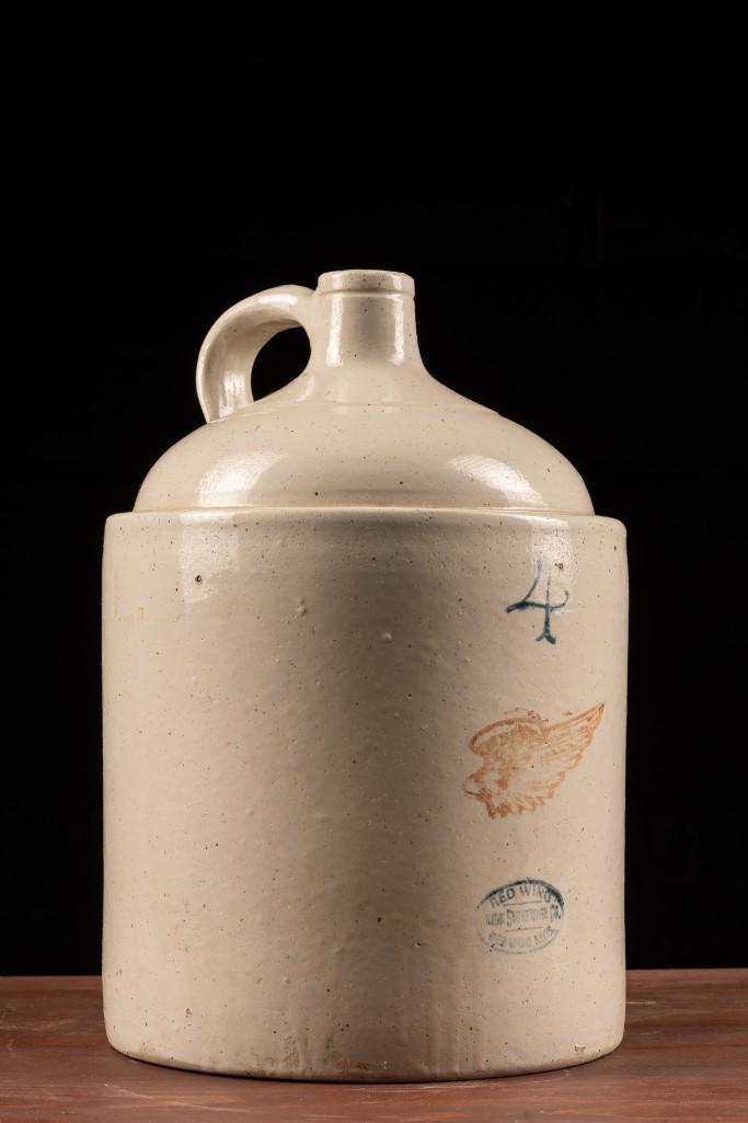 Vintage Red Wing Crock: This vintage Red Wing crock originated sometime during the early to mid 1900s, as indicated by the Red Wing stamp. This four gallon crock measures 11" in diameter and stands at a height of 17"