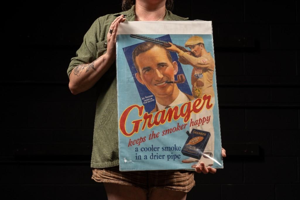 c. 1930 Granger Tobacco Advertisement Poster: **For an in-house shipping quote, please reach out to us at rockauctiongallery@gmail.com** Antique paper litho advertising sign for Granger-brand pipe tobacco, produced by Liggett & Myers Tobacco 