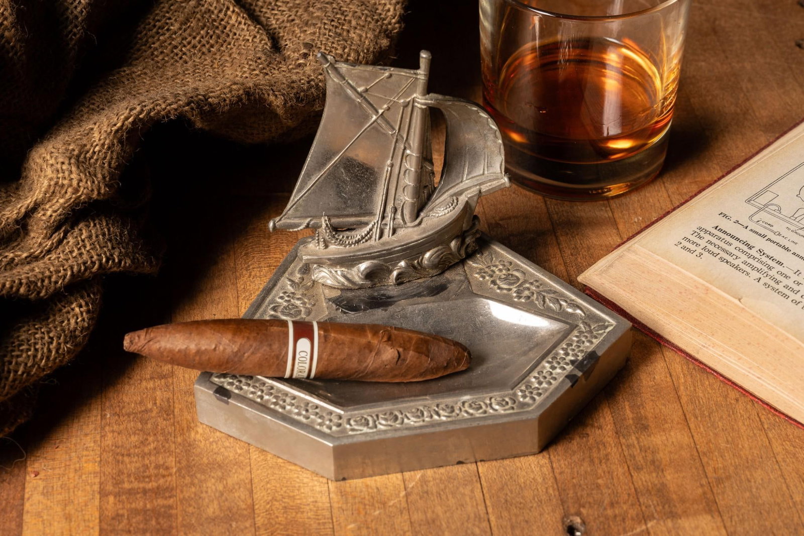 Figural Nickel Plated Ship Ashtray: Ornate nickel-plated ashtray with a figural schooner at one end. Exhibits minor tarnish. 6.25" W x 4.5" D x 4.25" H