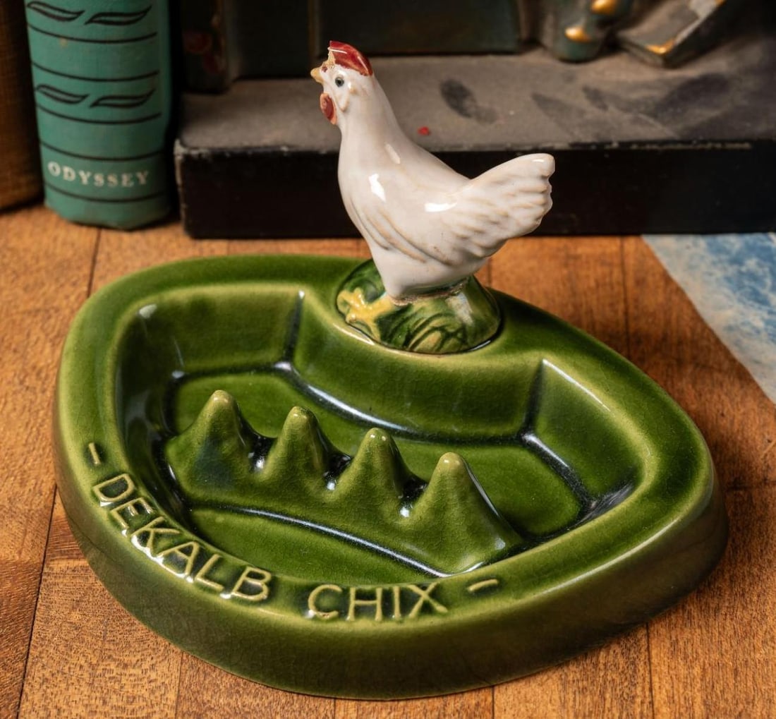 Vintage DeKalb Chix Agriculture Porcelain Ashtray: Painted porcelain ashtray in green with raised lettering and a figural chicken adornment.Â