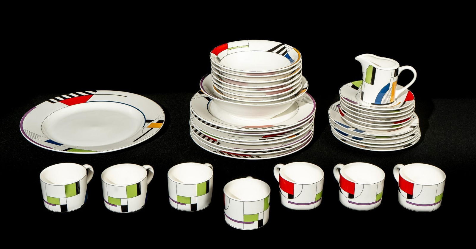 Post Modern Pop Art c. 1980 Memphis Dinner Service Set: Vintage oven and microwave safe porcelain serveware set with a 1980s Memphis style motif across all pieces. Manufactured by Sango and designated as "Radius 4916-20". Appear to be free from cr