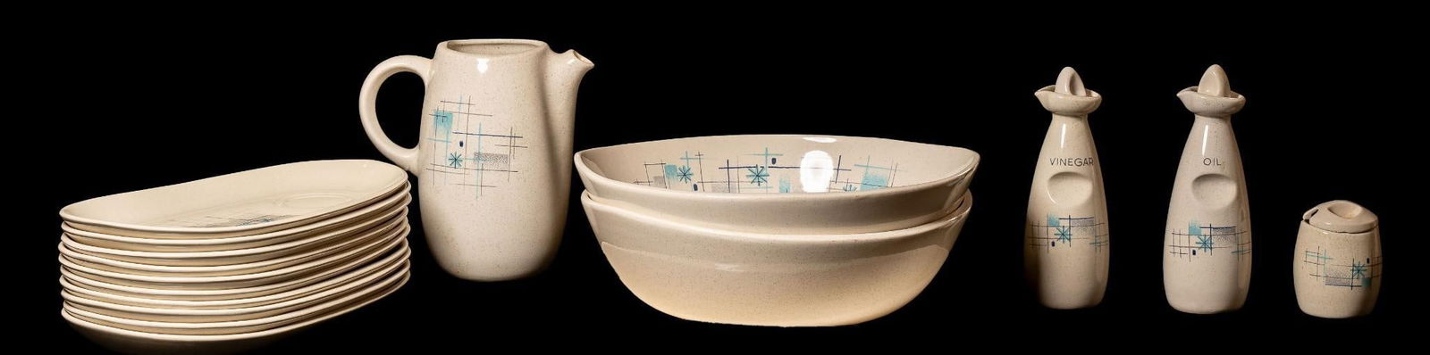 17-Piece Set of Atomic Age Gladding McBean Franciscan Serveware: Vintage porcelain dish set from Gladding-McBean's "Franciscan" line. This set, designated as "Oasis" was meant to invoke the feeling of the beach with a speckled "sand" des