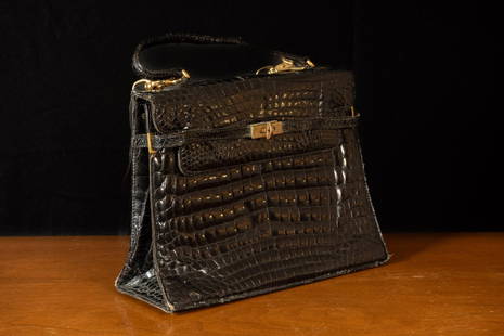 Vintage Morabito Alligator Skin Purse: Morabito Paris black leather purse with brass clasp and buckles.  Minor signs of wear consistent with age and use.  12&#34; W x 4&#34; D x 9&#34; H