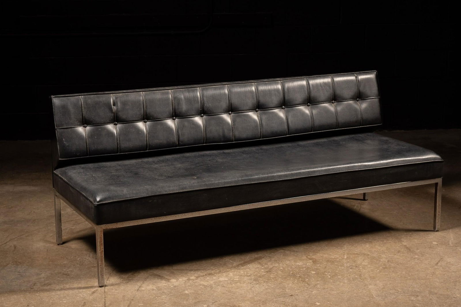Vintage Steelcase Leather Sofa Day bed: Mid-century button tufted leather sofa with steel frame. This piece, designed after Johannes Spalt's "Costanze", features a single row of shallow button tufts along its back and a sleek ch