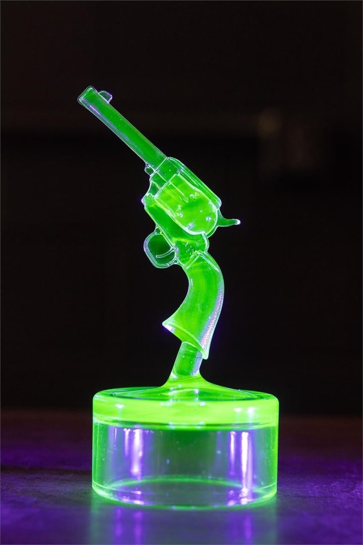 Vintage Uranium Glass Revolver Statuette: Item SKU: 7803 Figural, handgun-shaped uranium glass accent. 2.75" x 2.75" x 6" H Free from cracks, chips. Some scratches.
