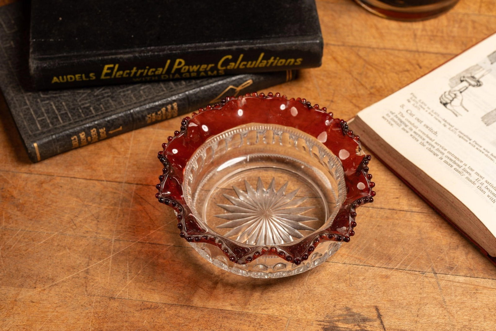 Frilled Tobacco Glass Edge Ashtray: Item SKU: C-10074 Circular glass ashtray with a cut starburst embellishment and frilled edges topped with glass beads. Minor scratches/scuffs. 4.5" dia, small chip on edge