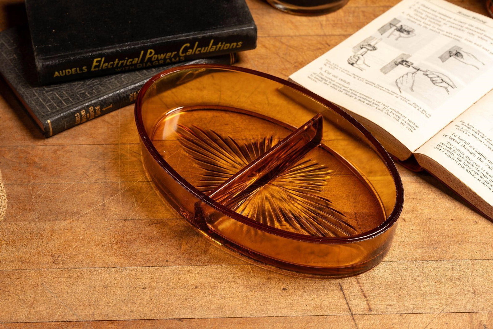 Tobacco Glass Divided Ashtray: Item SKU: C-10079 Oblong amber glass ashtray with cut geometric line work. Minor scratches/scuffs. 8.5" x 5" x 1.5" H