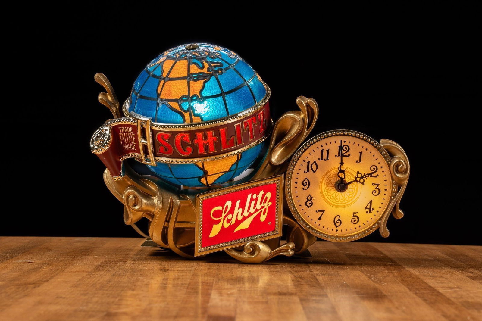 NOS Schlitz Grand Baroque Clock Register Beer Sign: NOTE: For an accurate in-house shipping quote on this lot, please reach out to us at rockauctiongallery@gmail.com. Item SKU: C-12352 Ornate plastic advertising sign with a dimensional globe and attach