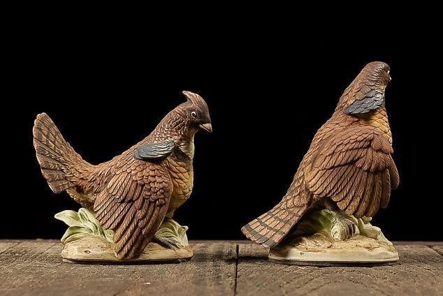 Ruffed Grouse Male and Female Pair by Lefton China: NOTE: For an accurate in-house shipping quote on this lot, please reach out to us at rockauctiongallery@gmail.com. Item SKU: C-13460 Pair of matte-glazed ceramic birds boasting exquisite detail. Appea
