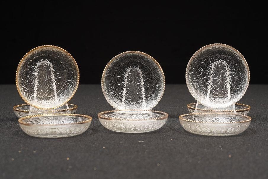 Set of Eight Vintage Etched Glass Coasters: NOTE: For an accurate in-house shipping quote on this lot, please reach out to us at rockauctiongallery@gmail.com. Item SKU: C-16073 This set includes eight small pressed glass pieces with etched flor