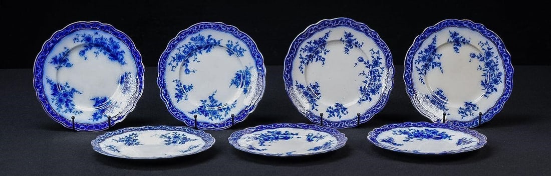 Set of Seven Alcock Flow Blue Dinner Plates: NOTE: For an accurate in-house shipping quote on this lot, please reach out to us at rockauctiongallery@gmail.com. Item SKU: C-17563 c. 1890s-1910s; Henry Alcock & Co. - Cobridge, Staffordshire, Engla