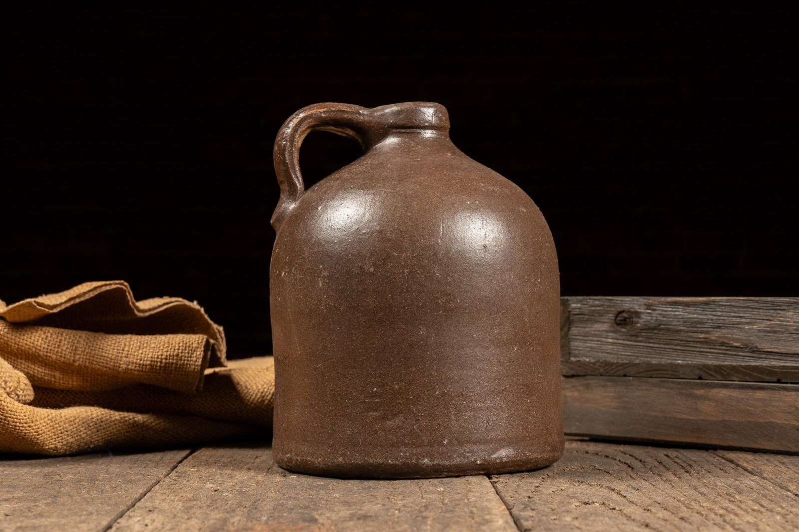 Small Brown Stoneware Jug: **NOTE: Any shipping quotes provided on this screen are provided by Live Auctioneers. For an in-house shipping quote on this lot, please reach out to us at rockauctiongallery@gmail.com.** 