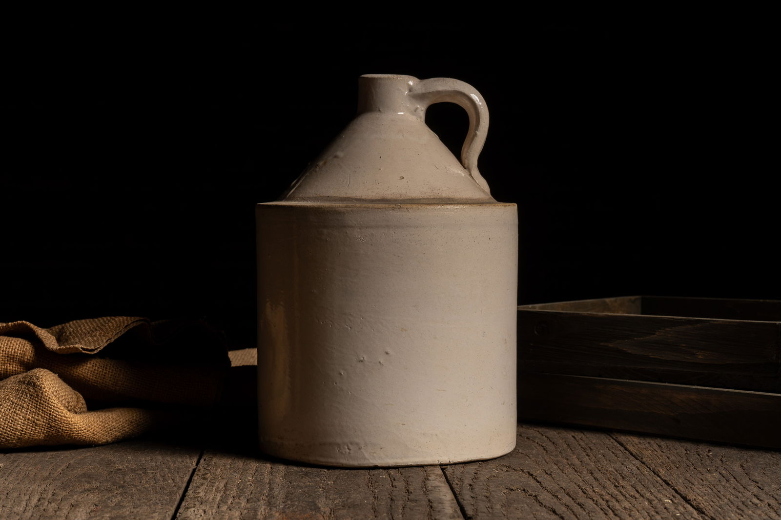 Off White Stoneware Crock Jug: **NOTE: Any shipping quotes provided on this screen are provided by Live Auctioneers. For an in-house shipping quote on this lot, please reach out to us at rockauctiongallery@gmail.com.** 