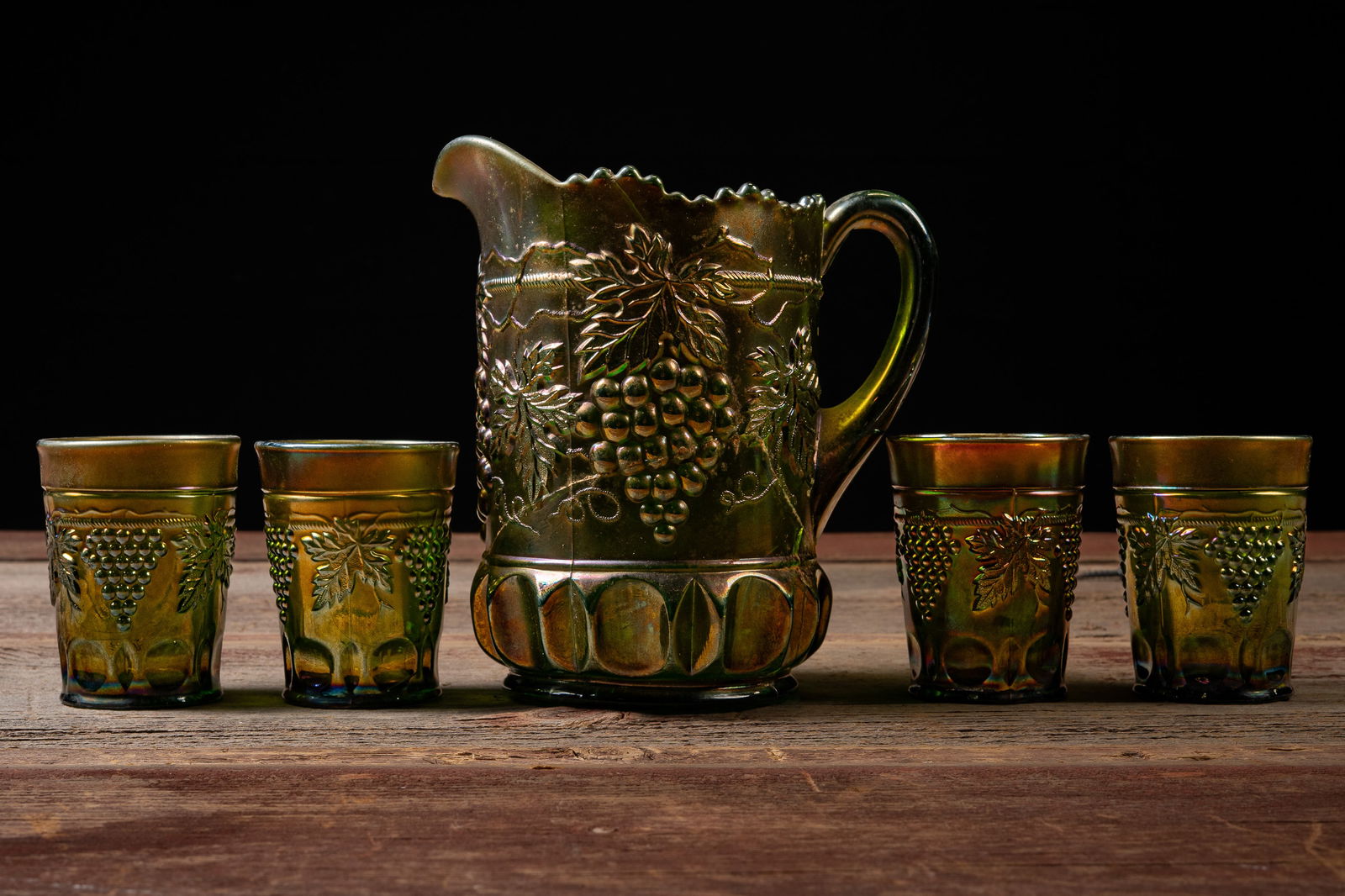 Vintage Carnival Glass Grapevine Water Set: **NOTE: Any shipping quotes provided on this screen are provided by Live Auctioneers. For an in-house shipping quote on this lot, please reach out to us at rockauctiongallery@gmail.com.** 