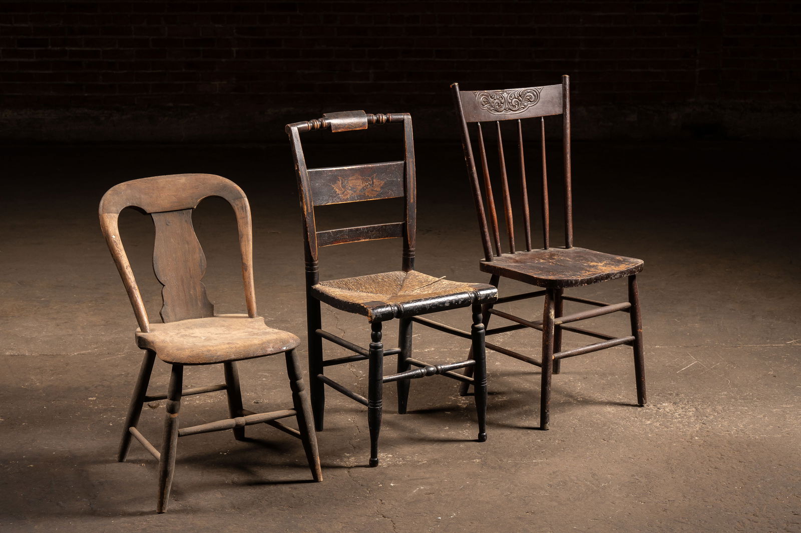 Lot Of Three Wooden Farmhouse Chairs: **NOTE: Any shipping quotes provided on this screen are provided by Live Auctioneers. For an in-house shipping quote on this lot, please reach out to us at rockauctiongallery@gmail.com.** C-19127