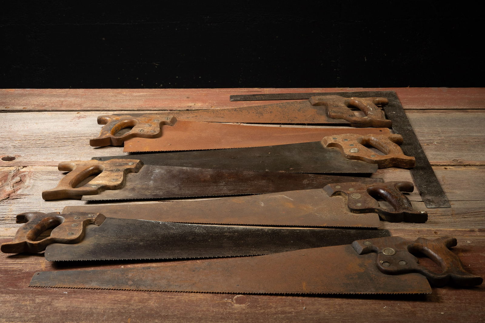 Antique Tool Lot - 7 Hand Saws & Framing Square: **NOTE: Any shipping quotes provided on this screen are provided by Live Auctioneers. For an in-house shipping quote on this lot, please reach out to us at rockauctiongallery@gmail.com.** C-19156