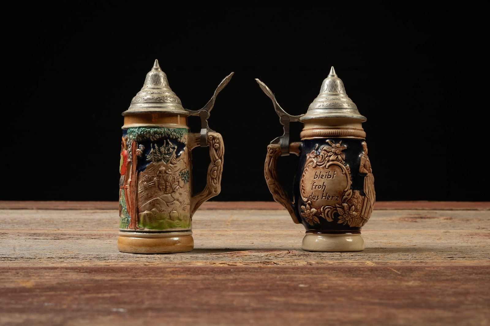 Pair of German Lidded Relief Beer Steins (1 of 5)