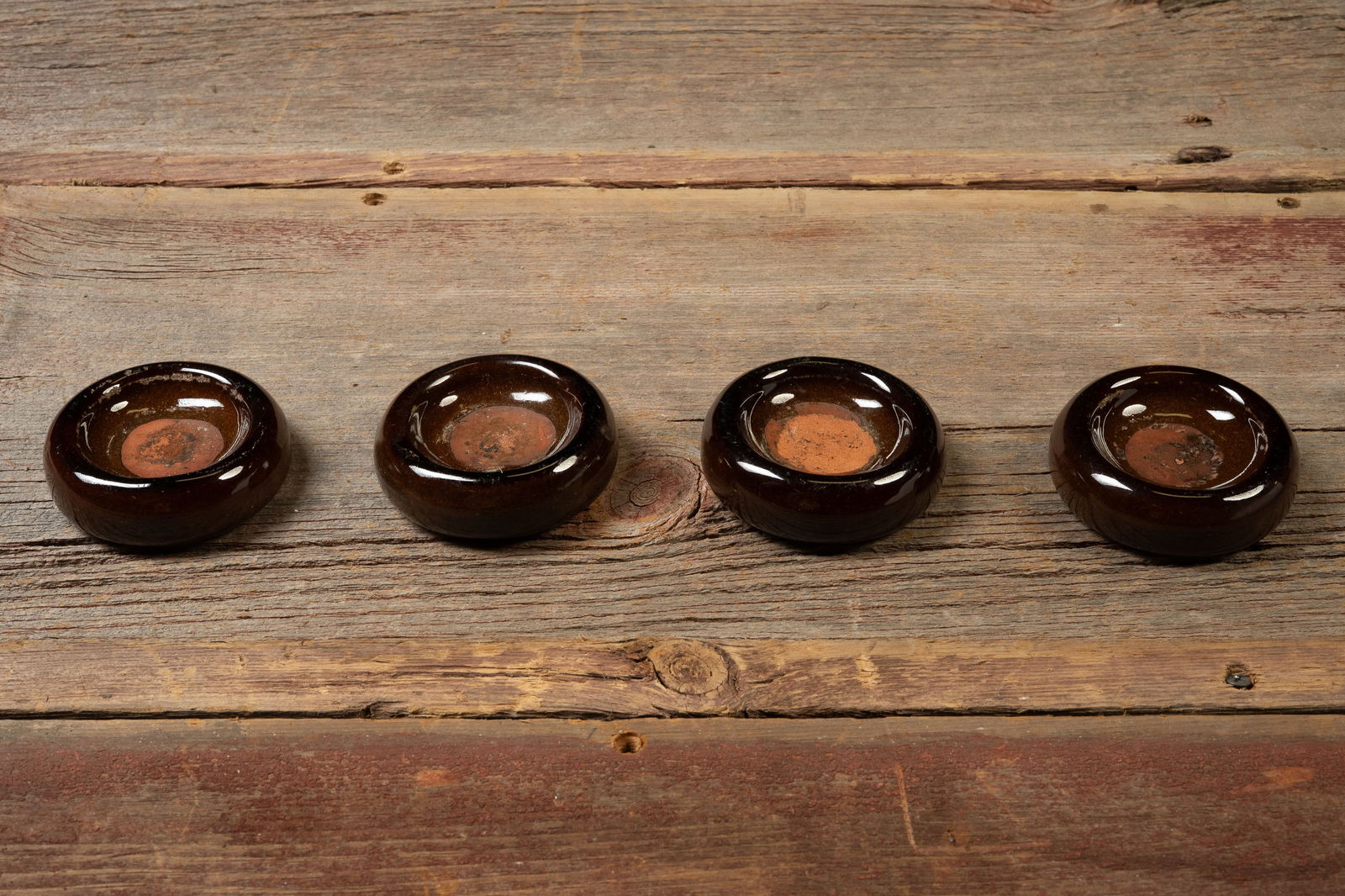 Set of 4 Brown Glazed Stoneware Ashtrays: **NOTE: Any shipping quotes provided on this screen are provided by Live Auctioneers. For an in-house shipping quote on this lot, please reach out to us at rockauctiongallery@gmail.com.** 