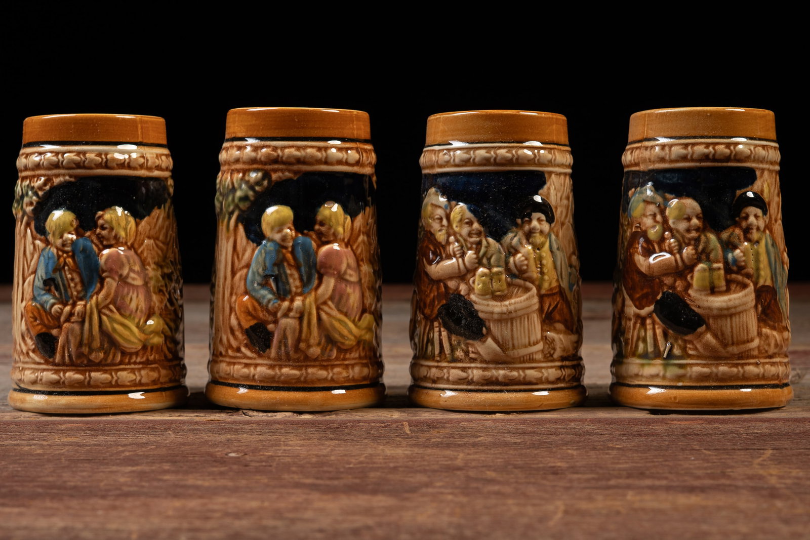 Set of 4 Hand Decorated German-Style Beer Steins: **NOTE: Any shipping quotes provided on this screen are provided by Live Auctioneers. For an in-house shipping quote on this lot, please reach out to us at rockauctiongallery@gmail.com.** 