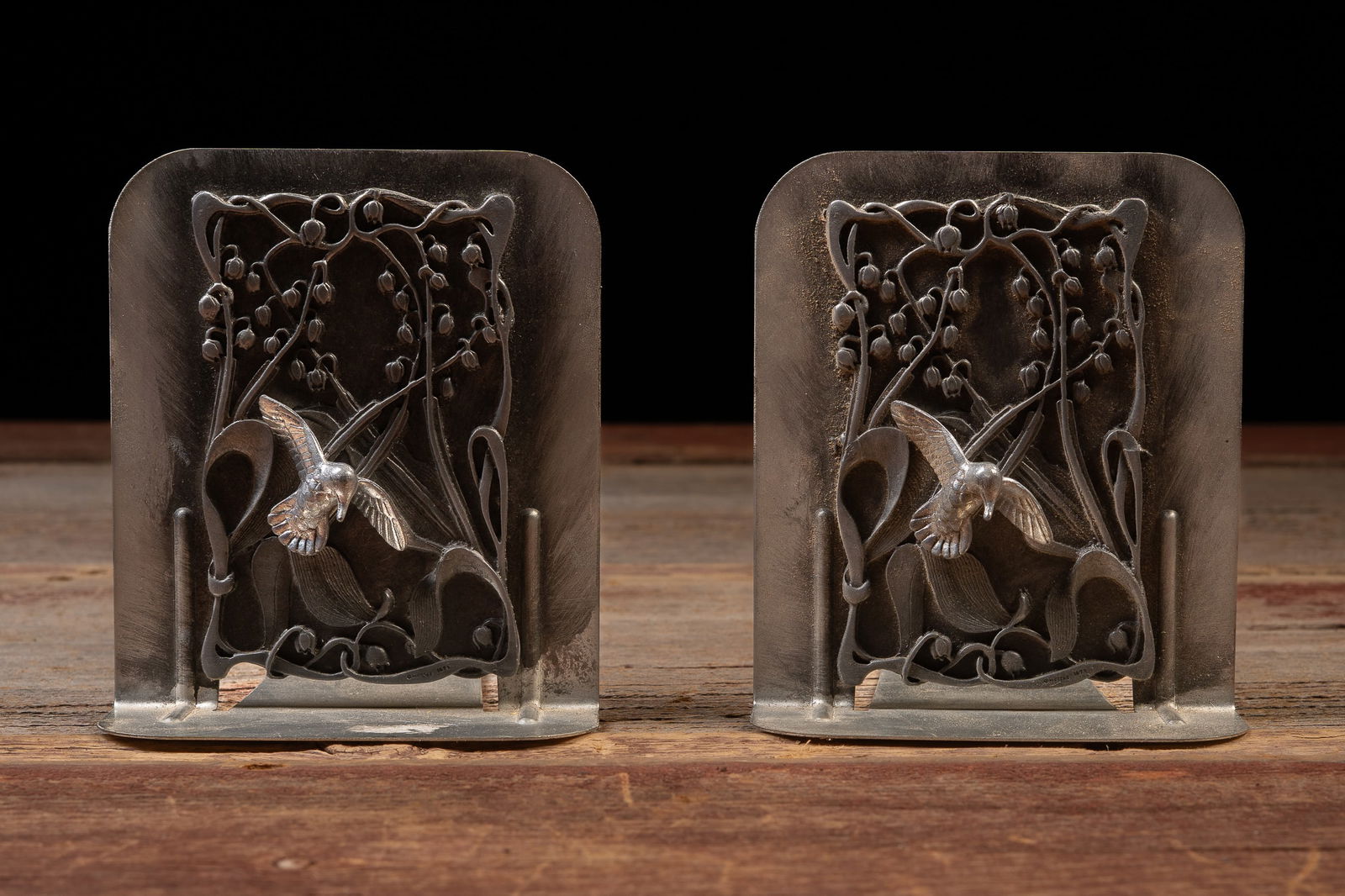 Pair of 1979 Metzke Pewter Hummingbird Bookends: **NOTE: Any shipping quotes provided on this screen are provided by Live Auctioneers. For an in-house shipping quote on this lot, please reach out to us at rockauctiongallery@gmail.com.** 