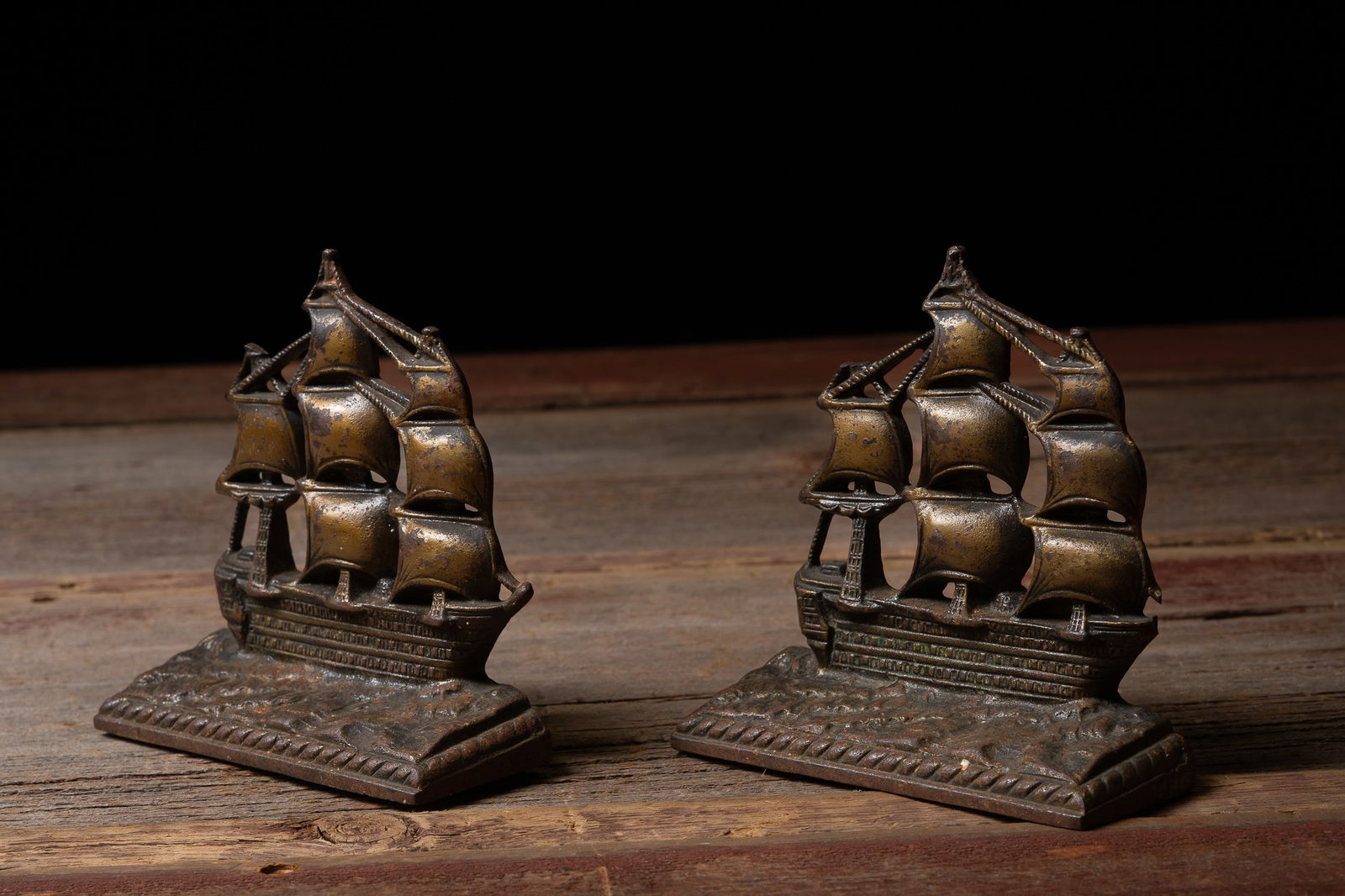 Painted Cast Iron 'HMS Victory' Ship Bookends: **NOTE: Any shipping quotes provided on this screen are provided by Live Auctioneers. For an in-house shipping quote on this lot, please reach out to us at rockauctiongallery@gmail.com.** 