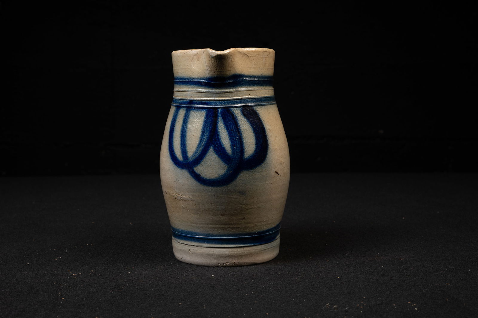 19th Century Cobalt Decorated Stoneware Pitcher: **NOTE: Any shipping quotes provided on this screen are provided by Live Auctioneers. For an in-house shipping quote on this lot, please reach out to us at rockauctiongallery@gmail.com.** C-19321