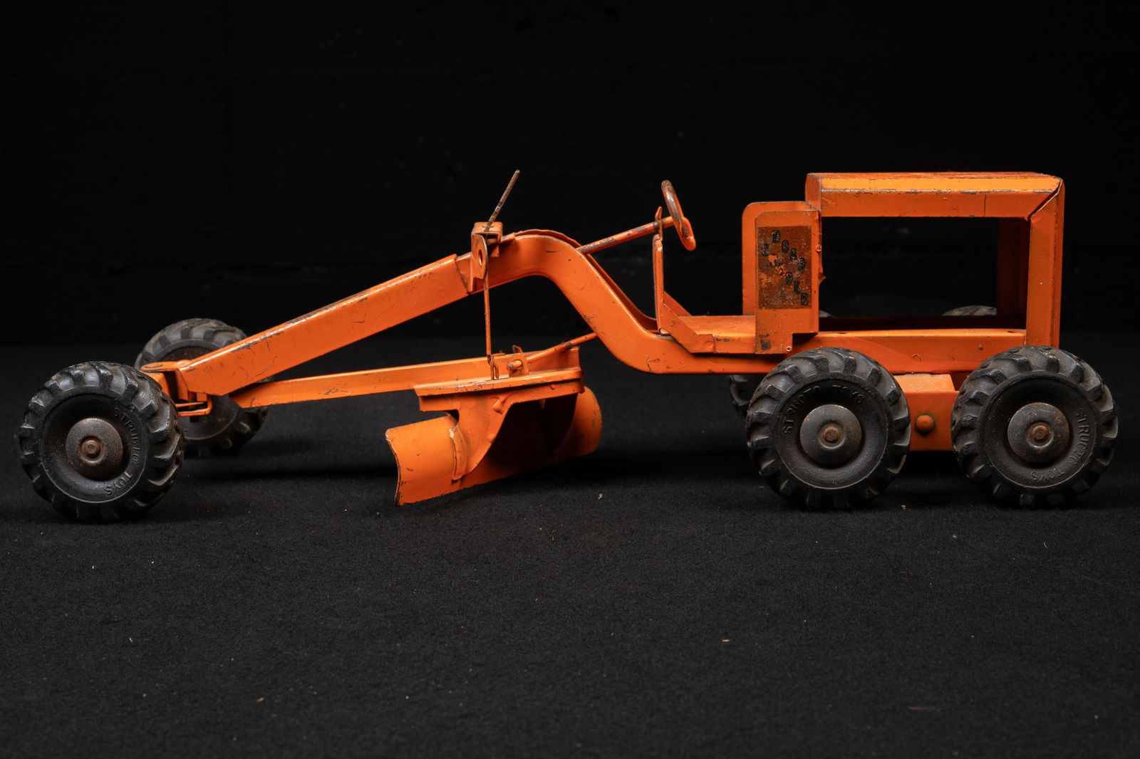 Structo Road Grader Pressed Steel Construction Toy: **NOTE: Any shipping quotes provided on this screen are provided by Live Auctioneers. For an in-house shipping quote on this lot, please reach out to us at rockauctiongallery@gmail.com.** C-19325
