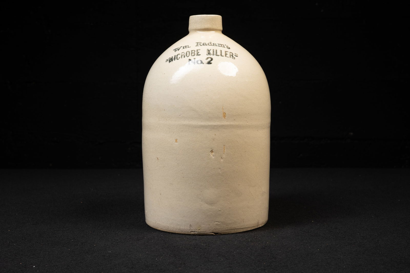 Wm. Radam â€?Microbe Killerâ€? No. 2 Stoneware Jug: **NOTE: Any shipping quotes provided on this screen are provided by Live Auctioneers. For an in-house shipping quote on this lot, please reach out to us at rockauctiongallery@gmail.com.** 