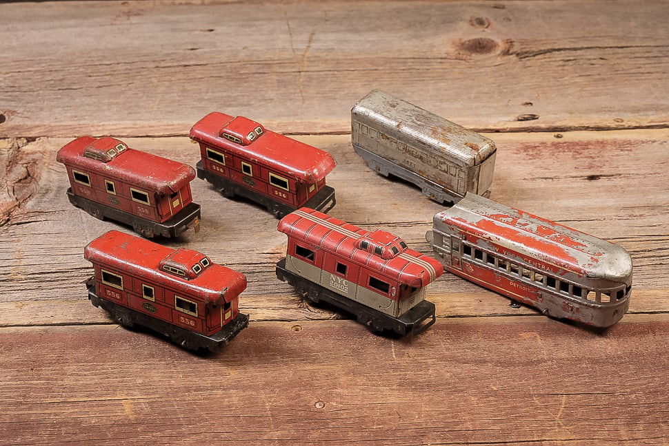 Lot of 6 Tin Litho Train Cars: **NOTE: Any shipping quotes provided on this screen are provided by Live Auctioneers. For an in-house shipping quote on this lot, please reach out to us at rockauctiongallery@gmail.com.** C-19508