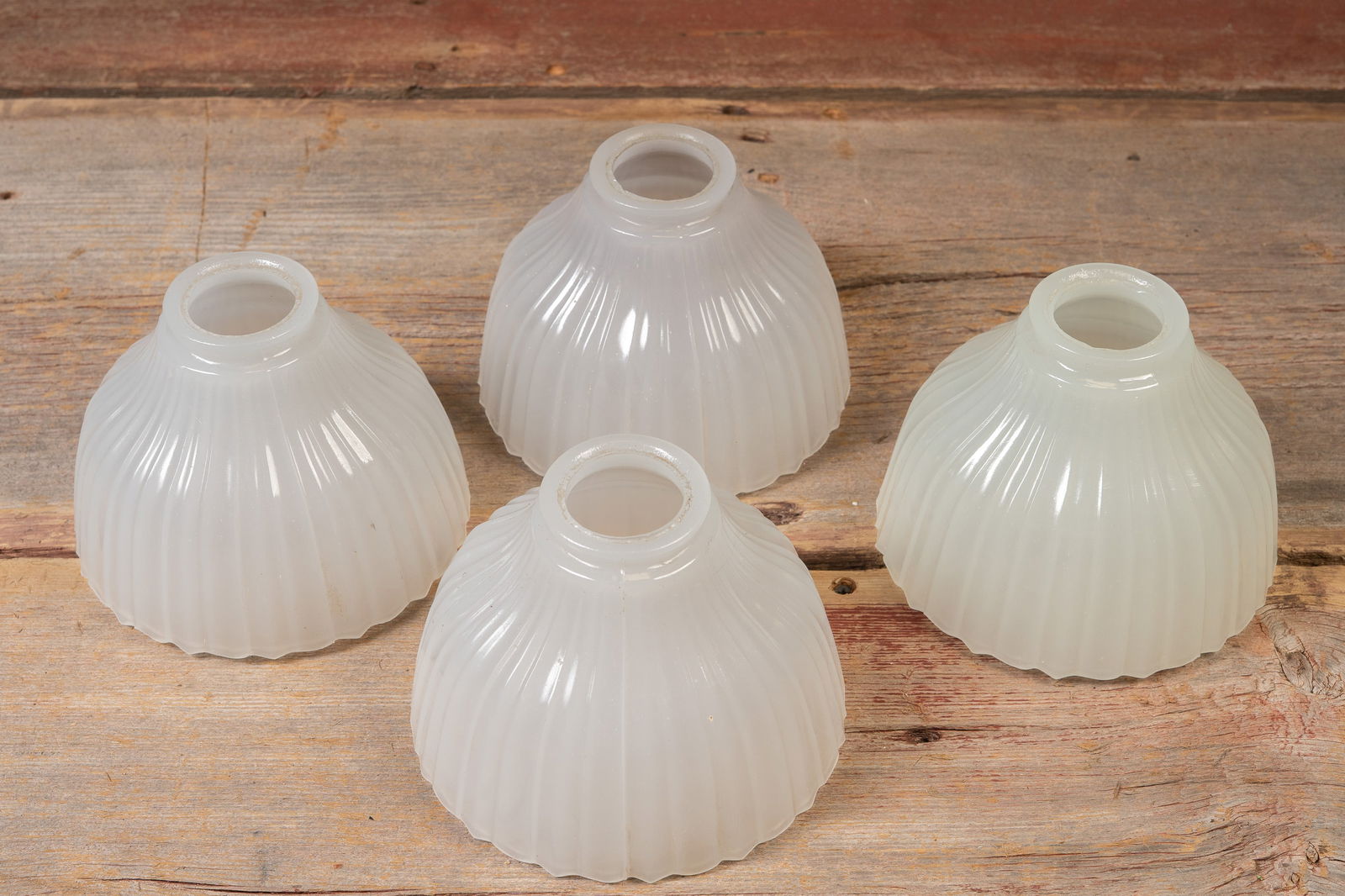 Set of Four Ribbed Translucent Glass Lamp Shades: **NOTE: Any shipping quotes provided on this screen are provided by Live Auctioneers. For an in-house shipping quote on this lot, please reach out to us at rockauctiongallery@gmail.com.** 