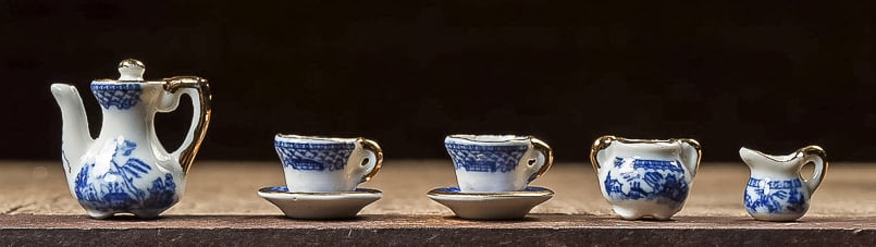 Miniature Blue Willow Doll Tea Set with Gold Trim: **NOTE: Any shipping quotes provided on this screen are provided by Live Auctioneers. For an in-house shipping quote on this lot, please reach out to us at rockauctiongallery@gmail.com.** C-14030 This