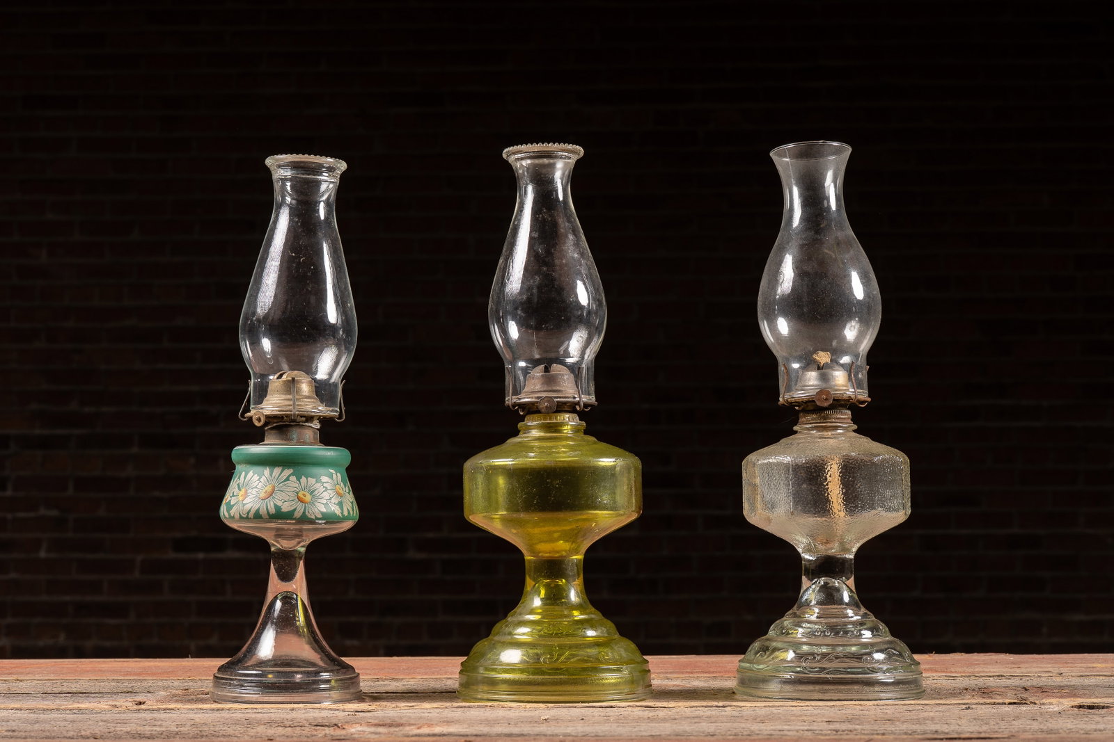Set of Three Pressed and Molded Glass Oil Lamps: **NOTE: Any shipping quotes provided on this screen or on your Live Auctioneers invoice are provided by Live Auctioneers. In-house shipping is available on all lots. For in-house shipping quotes, plea