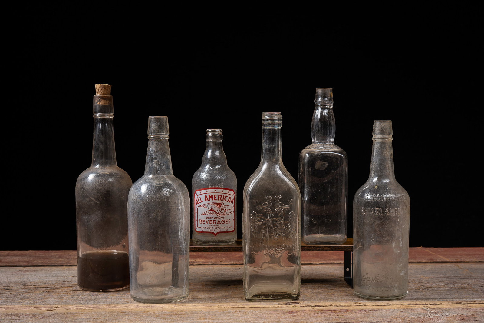 Lot 8 Antique Clear Glass Bottles, Embossed: **NOTE: Any shipping quotes provided on this screen or on your Live Auctioneers invoice are provided by Live Auctioneers. In-house shipping is available on all lots. For in-house shipping quotes, plea