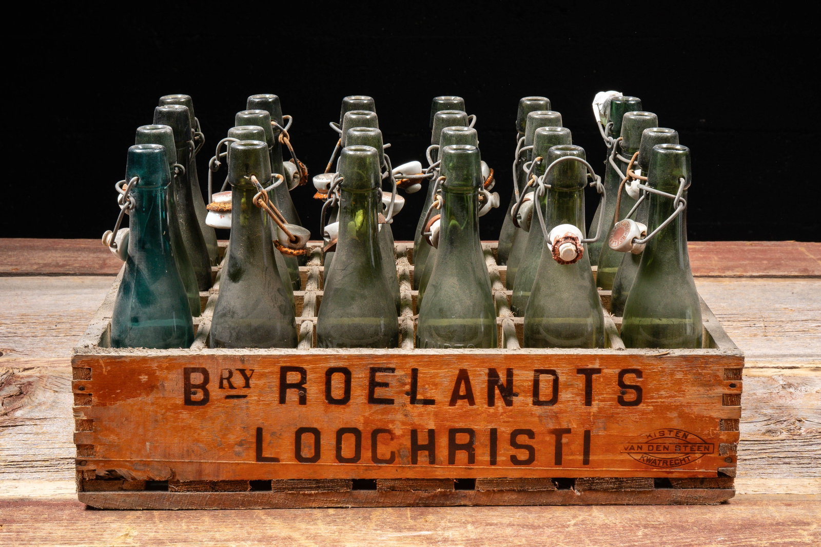 Lot of Belgian Swing Top Beer Bottles with Crate: **NOTE: Any shipping quotes provided on this screen or on your Live Auctioneers invoice are provided by Live Auctioneers. In-house shipping is available on all lots. For in-house shipping quotes, plea